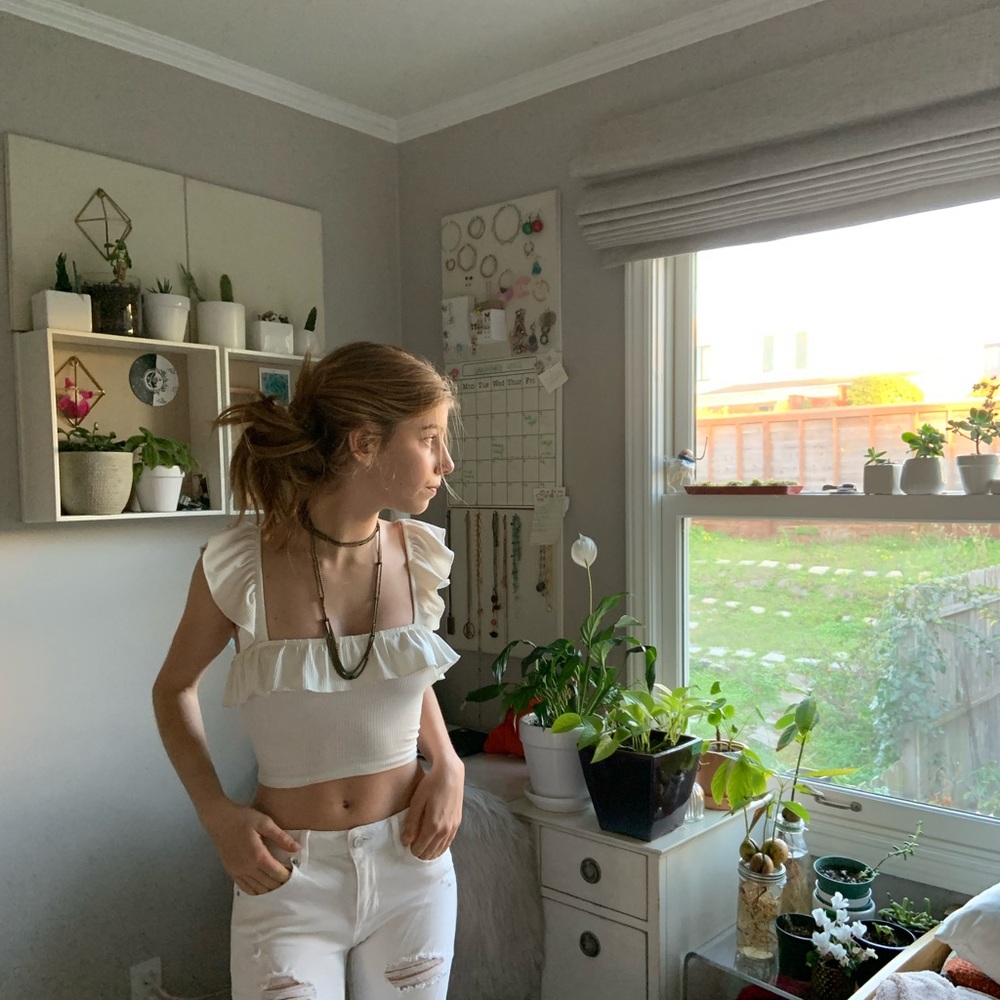 Cropped White Tank Top With ruffled sleeves.